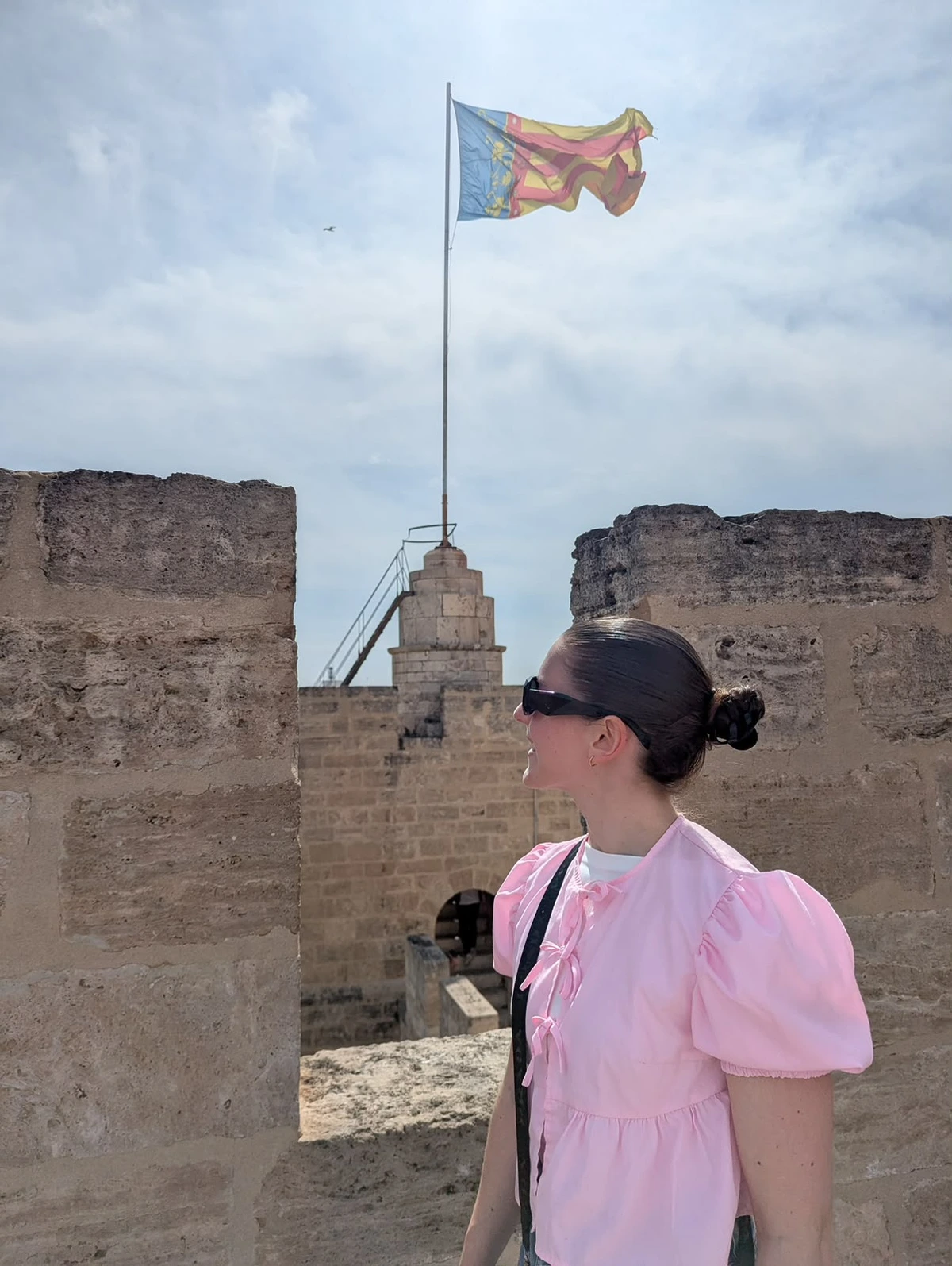 Ellen visiting a historic site in Spain